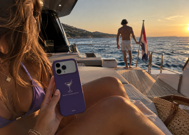 Purple Solova case at sunset on a yacht