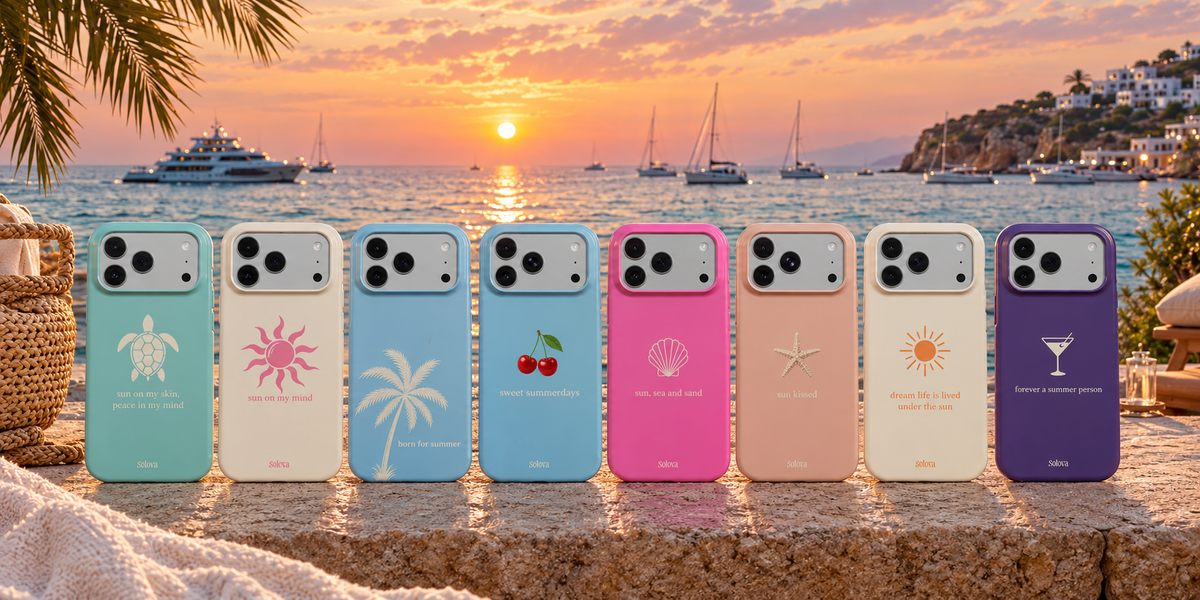Solova phone cases lined up on a sunset terrace by the sea